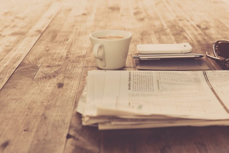 newspaper and coffee cup