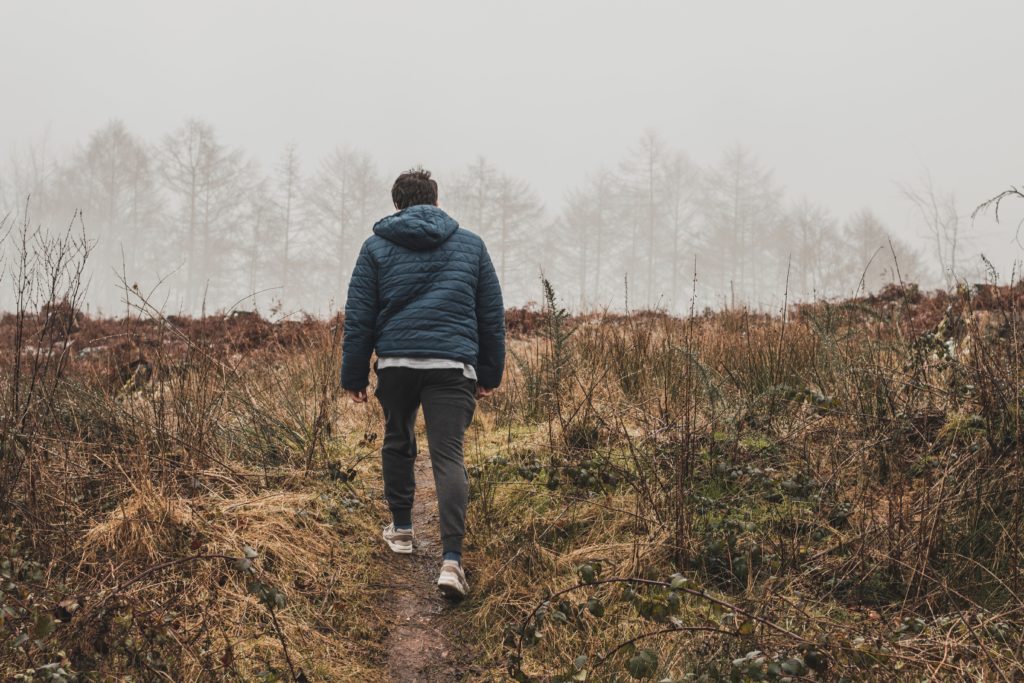 walking on a trail in the field