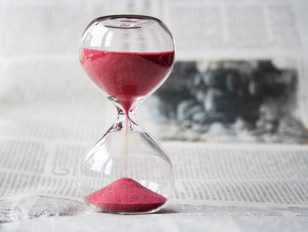 hour glass with red sand