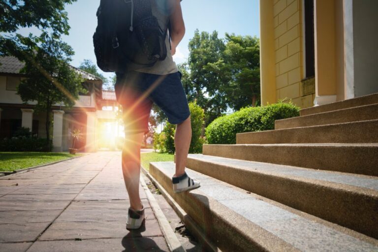 person walking up the steps