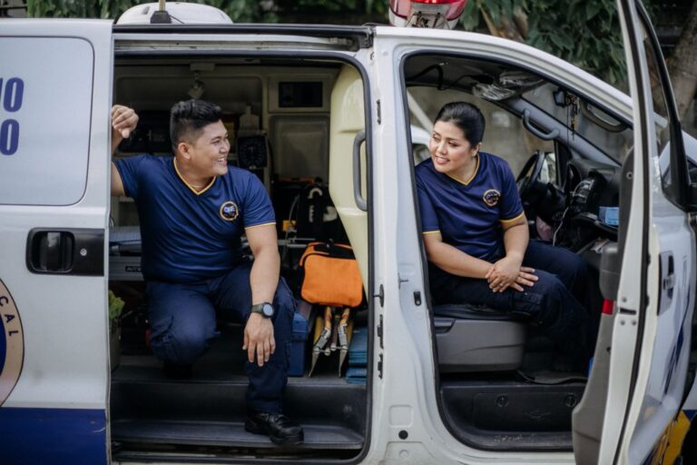 Medics talking in emergency van while parked