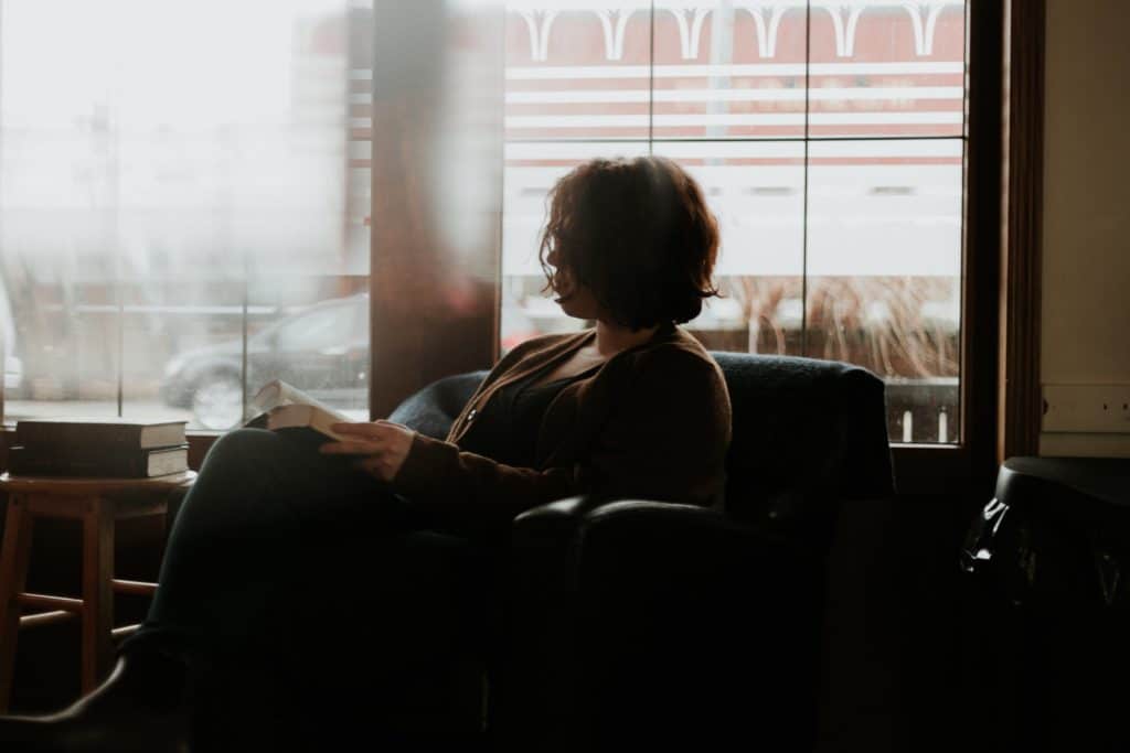 Lady Looking Out The Window Coping With Addiction