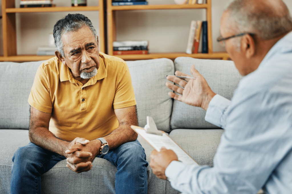 Man talking to a counselor about methadone treatment